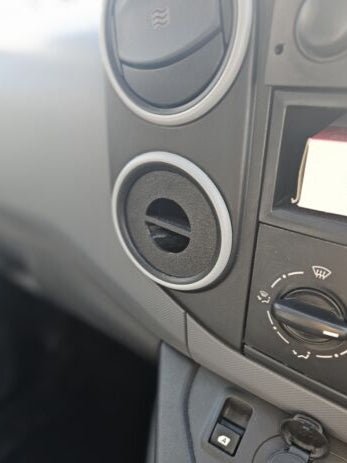 The picture shows the internal dashboard of a Citroen Berlingo and Peugeot Partner van. The product is in place where it will allow a phone mount to be positioned.